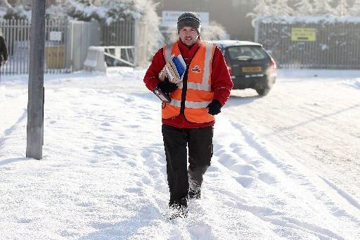 Postman Joe McAlea doing his rounds despite the wintery weather in 2010.