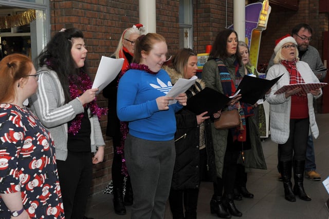 The Calms Choir,and the Liberty Consortium HUB choir at Northside Village Centre, entertain shoppers with Christmas carols on Wednesday morning last. DER2148GS – 020