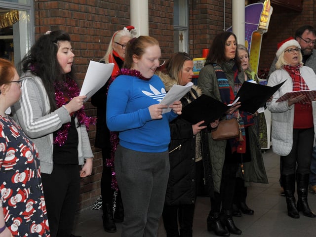 The Calms Choir,and the Liberty Consortium HUB choir at Northside Village Centre, entertain shoppers with Christmas carols on Wednesday morning last. DER2148GS – 020