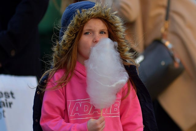 Adam B fan enjoying a candyfloss at the Christmas Market in Guildhall Square on Saturday afternoon last. Photo: George Sweeney.  DER2148GS – 052
