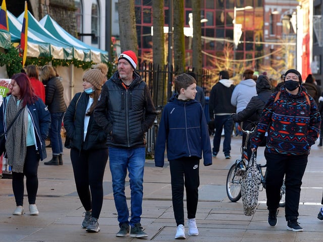 People stroll through the Christmas Market in Guildhall Square on Saturday afternoon last. Photo: George Sweeney. DER2148GS – 053