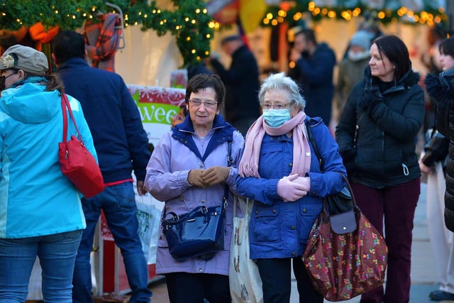 Shoppers at the Christmas Market in Guildhall Square on Saturday afternoon last. Photo: George Sweeney.  DER2148GS – 057
