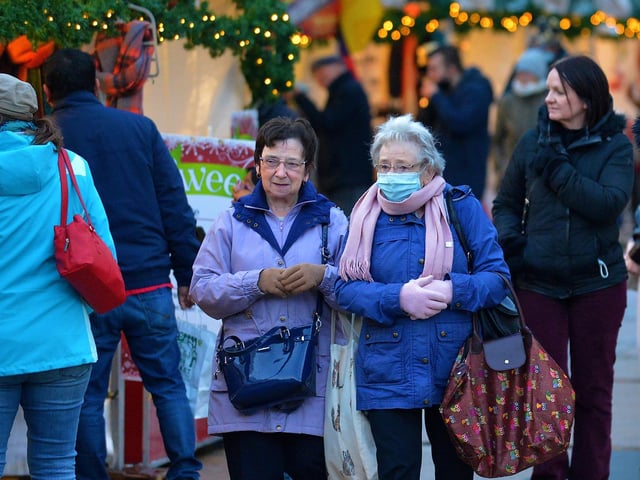 Shoppers at the Christmas Market in Guildhall Square on Saturday afternoon last. Photo: George Sweeney. DER2148GS – 057