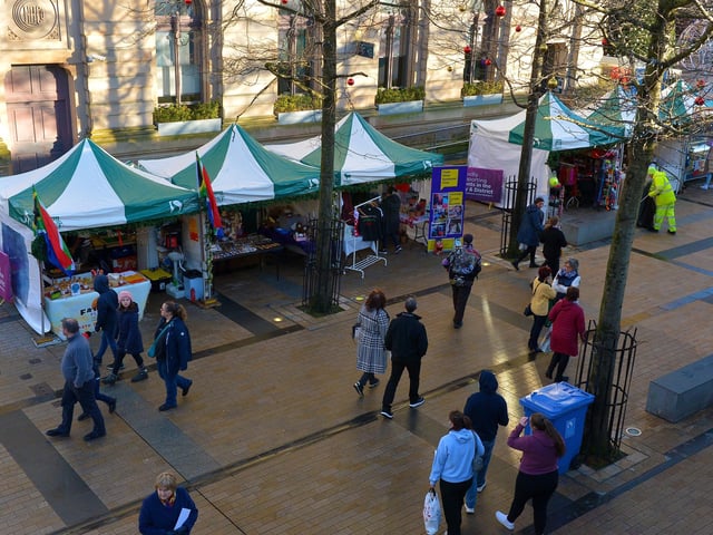 Some of the stalls at the Christmas Market in Guildhall Square on Saturday afternoon last. Photo: George Sweeney.  DER2148GS – 055