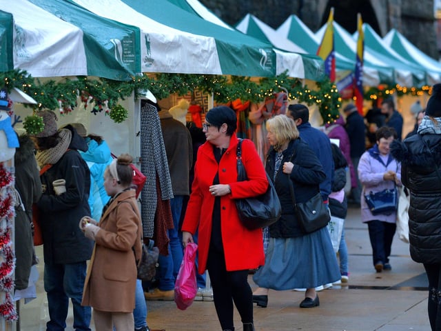 People browse at the Christmas Market in Guildhall Square on Saturday afternoon last. Photo: George Sweeney.  DER2148GS – 056