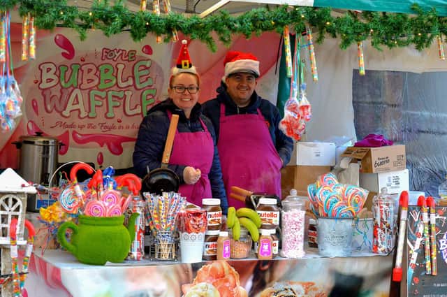Stall holders at the Christmas Market in Guildhall Square on Saturday afternoon last. Photo: George Sweeney.  DER2148GS – 048