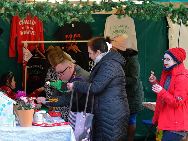 People browse the stalls at the Christmas Market in Guildhall Square on Saturday afternoon last. Photo: George Sweeney. DER2148GS – 049