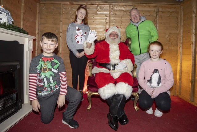 The Orr family visit Santa at The North Coast Post Office in Coleraine's Diamond Centre