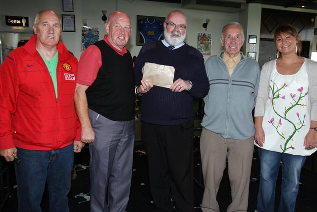 The Caring Caretaker Davy Boyle is presented with a cheque from Jimmy Alexander on behalf of the referees at the LMA presentation in the Coleraine FC Social Club on Saturday. Included are Tommy Doherty, David Macaulay and Claire Acheson. CR29-PL