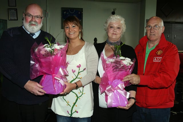 Claire and Elaine Acheson are presented with flowers from Davy Boyle and Tommy Doherty at the LMA presentation in the Coleraine FC Social Club on Saturday. Included are Tommy Doherty and Elaine Acheson. CR29-PL