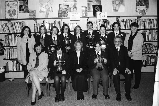 Students who received cups at the Oakgrove College prizegiving. From left, seated, are Mrs. Marie Gowan, College Principal, Catherine Malcolm, joint holder of the sports cup, Rev. Rosemary Logue, Rector of St. Augustine’s, guest speaker, Barry Casey, Librarian Cup and Mr. James Laverty, Chairman of the College Board of Governors. Standing, Mrs. Elizabeth Caughey, Head of English, Bronwyn Simpson and Rachelle Norry, joint holders of the Writers Cup, Rachael Coulter, Cup for Curriculum Activities, Louise Carey, Commitment Cup, John Laverty, joint holder of the Sports Cup, Alex Finley, Friendship Cup, Patricia Mayers, Duke of Edinburgh Award Scheme and Teresa Gillespie, Head of PE.