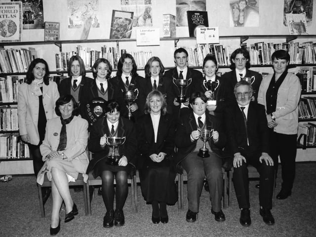 Students who received cups at the Oakgrove College prizegiving. From left, seated, are Mrs. Marie Gowan, College Principal, Catherine Malcolm, joint holder of the sports cup, Rev. Rosemary Logue, Rector of St. Augustine’s, guest speaker, Barry Casey, Librarian Cup and Mr. James Laverty, Chairman of the College Board of Governors. Standing, Mrs. Elizabeth Caughey, Head of English, Bronwyn Simpson and Rachelle Norry, joint holders of the Writers Cup, Rachael Coulter, Cup for Curriculum Activities, Louise Carey, Commitment Cup, John Laverty, joint holder of the Sports Cup, Alex Finley, Friendship Cup, Patricia Mayers, Duke of Edinburgh Award Scheme and Teresa Gillespie, Head of PE.