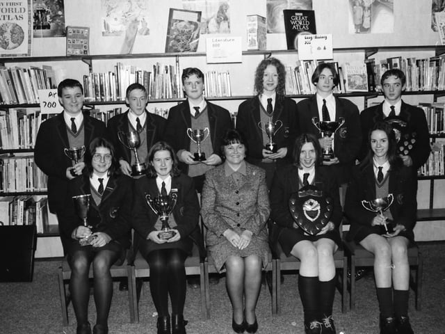 Mrs. Ruth Watts, Head of Year 11, with students who received subject awards at Oakgrove Integrated College.