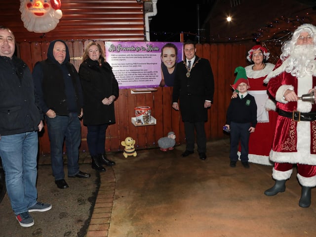 Mayor Graham Warke with Santa, Mrs. Clause and Elf when he visited Amelia Court Christmas tree lights. Houses in the area are lit up to raise funding in aid of local girl Nicole, who suffers from FND (Functional Neurological Disorder). Included from left are Colr. Brian Tierney, Phonsie McDermott and Nicola McDaid, parents of Nicole. (Photo - Tom Heaney, nwpresspics)