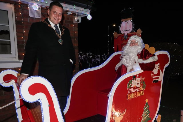 Mayor Graham Warke with Santa on his sleigh when he visited Amelia Court Christmas tree lights. Included is Colr. Brian Tierney. (Photo - Tom Heaney, nwpresspics)