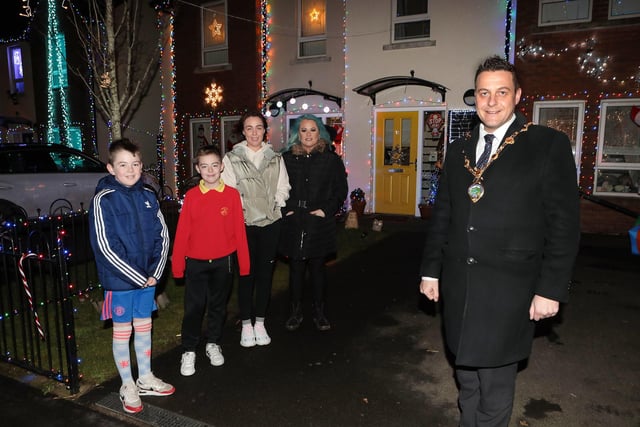 Mayor Graham Warke joins Santa on his sleigh when he visited Christmas Drive, which is lit up for Christmas as a fundraiser for the Foyle Hospice and Hurt charities. Included are Colr. Brian Tierney and Laura Meehan, fundraiser. (Photo - Tom Heaney, nwpresspics)