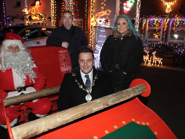 Mayor Graham Warke joins Santa on his sleigh when he visited Christmas Drive, which is lit up for Christmas as a fundraiser for the Foyle Hospice and Hurt charities. Included are Colr. Brian Tierney and Laura Meehan, fundraiser. (Photo - Tom Heaney, nwpresspics)