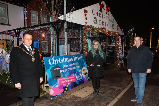 Mayor Graham Warke on a visit to Christmas Drive, which is lit up for Christmas as a fundraiser for the Foyle Hospice and Hurt charities. Included are Laura Meehan, fundraiser, and Colr. Brian Tierney. (Photo - Tom Heaney, nwpresspics)