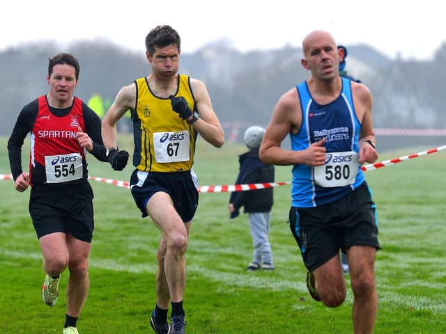 Niall McGee (67), Inishowen Athletic Club chases Ballymena Runners' Ian McCracken with City of Derry's Kieran Hurley for company. Photo: George Sweeney.  DER2150GS – 065