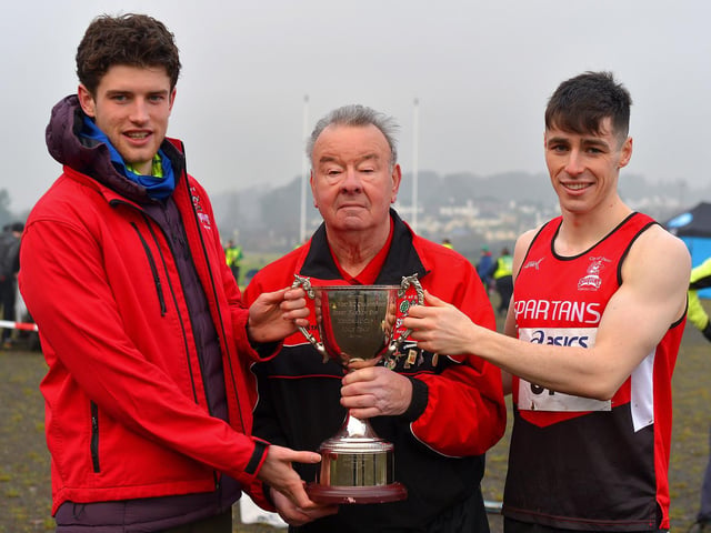 Fintan Stewart and Luke McCarron , representing City of Derry Spartans men’s team, receive the Bobby Farren Snr Memorial Cup, from Charlie Large, at the North West Cross Country meeting. Photo: George Sweeney.  DER2150GS – 057