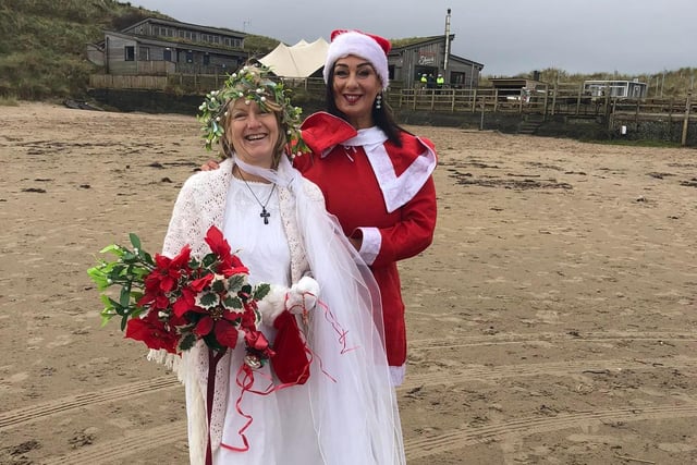 A Christmas Angel and Santa aka Susan and Nuala all set for the Christmas Eve dip in the sea
