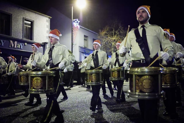 Members of the Orange Order along with local bandsmen take part in a Christmas themed procession through Markethill