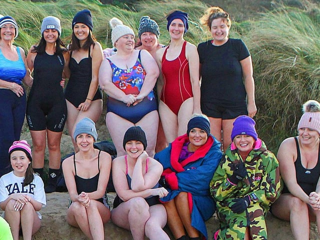 Derry celebrity Mickey Doherty joins the ladies from the "Waves" cold water swim group organised by "Mammy Banter" for the New Year's swim at Lisfannon Beach. Photo: George Sweeney. DER2152GS 022