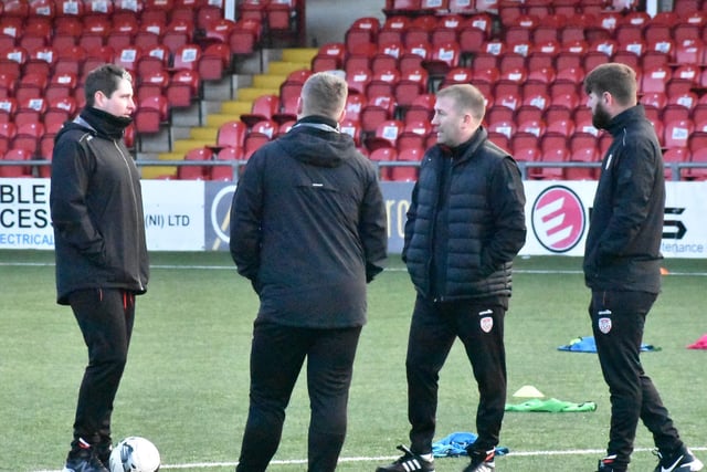 Derry City manager Ruaidhri Higgins, assistant boss Alan Reynolds, Technical Director Paddy McCourt and coach, Conor Loughery have a chat before training.