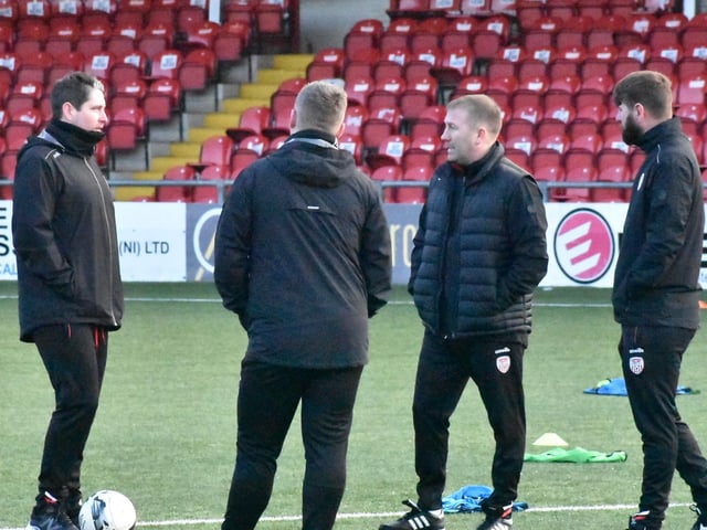 Derry City manager Ruaidhri Higgins, assistant boss Alan Reynolds, Technical Director Paddy McCourt and coach, Conor Loughery have a chat before training.