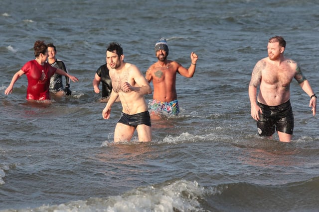 Swimmers from the "Waves" cold water swim group organised by "Mammy Banter" for the New Year's swim at Lisfannon Beach. Photo: George Sweeney.  DER2152GS  024
