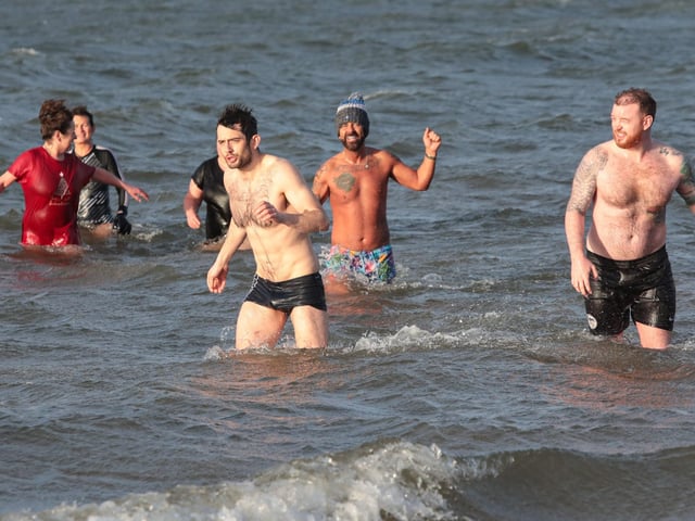 Swimmers from the "Waves" cold water swim group organised by "Mammy Banter" for the New Year's swim at Lisfannon Beach. Photo: George Sweeney. DER2152GS 024