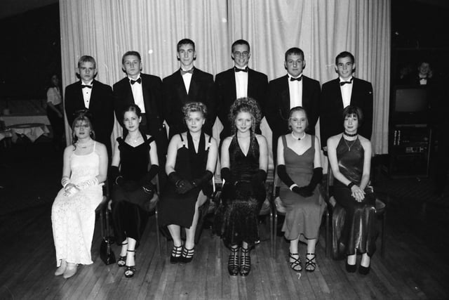 From left, seated, Jacky Johnston, Amanda Ferguson, Michelle Brace, Emma Simpson, Karen Knobbs and Gemma Keighley. Standing, Jonathan Heywood, Billy Heywood, Glen Montgomery, Darren Mitchel, Leslie Curry and Ally Dunn, at the Faughan Valley High School  formal at the Inn at the Cross.