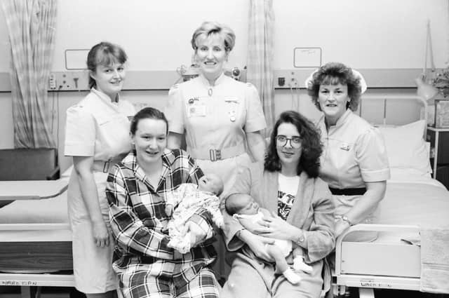 Sinead McGlinchey, seated left, from Epworth Street, with her daughter, Nina, born 11.47am on New Year’s Day 1997 weighing 7lb. 13 oz., and Marcia McFeely, from Liscloon Drive, with her son Aaron, born at 6.15am on New Year’s Day weighing 9lb. Included, from left, Staff Midwives Beverly Crothers and Moira Blee and Ward Sister Geraldine Sloane.