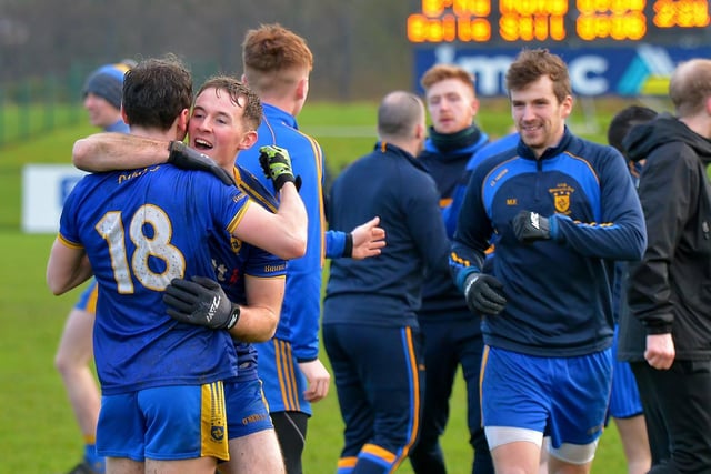 Sharpshooter Cahir McMonagle is congratulated by his teammates at the final whistle.