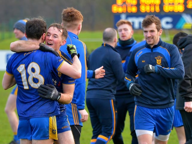 Sharpshooter Cahir McMonagle is congratulated by his teammates at the final whistle.
