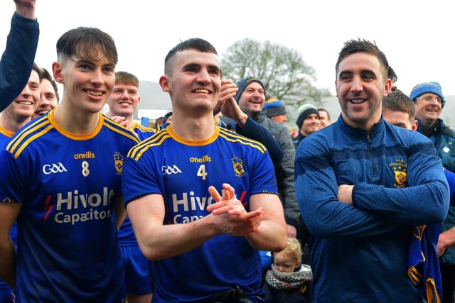 Steelstown’s Oran McMenamin, Dairmuid Baker and Ryan Devine watch on as Neil Forester lifts the cup.
