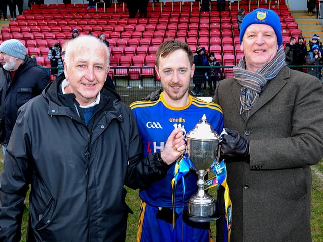 Brian Og McKeever senior (left) pictured with Steelstown captain Neil Forester and one of the club’s founders Philip Devlin at Owenbeg.