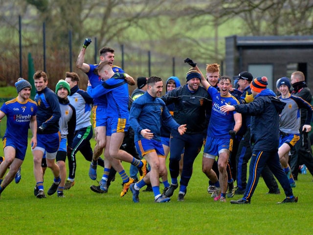Steelstown players and coaches celebrate at the final whistle.