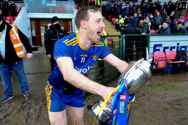 Steelstown’s captain Neil Forester races onto the pitch with the cup to celebrate their Ulster GAA Football Intermediate Club Championship victory