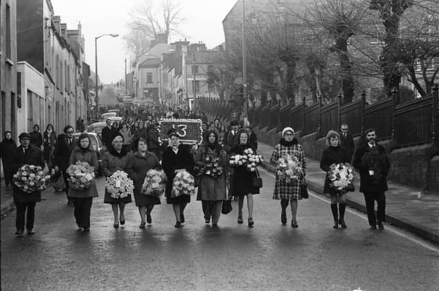 Families lead the 1974 commemoration march at Creggan Street.