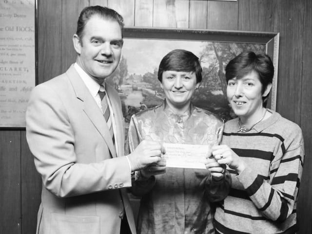Mr. Bernard O’Kane, proprietor, Gallery Bar, presents the proceeds of the pub’s Christmas Draw, £250, to Sr. Nora Canning and Sr. Kate McDaid in aid of the special care baby unit  at Altnagelvin.