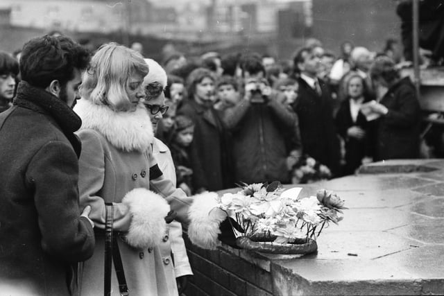 1973... Ita McKinney lays a wreath for her murdered husband on the first anniversary.