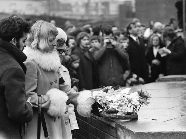 1973... Ita McKinney lays a wreath for her murdered husband on the first anniversary.
