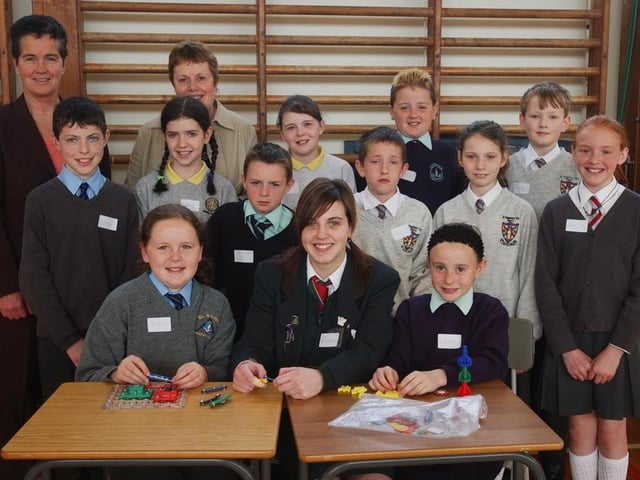 Children from local primary schools pictured at a Primary Mathematics "Keyquest" Roadshow held at St Cecilia's College. Included, are Vida Given, Sentinus, Roisin Lynch, vice prinicpal, and Rebecca Davidson, St Cecilia's College. (2105A03)