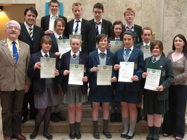 Cumann Gaelach Chnoc na Ros, in conjunction with Derry City Council, present bursaries to pupils and adults who will be participating in Irish courses in Donegal this summer. Included are Risteard Mac Gabhann, Uachtaran Oireachtas na Gaelige, Councillor Gearard Diver, and Clar Ni Chnaimhsi, Gaelic officer. Schools represented at the presentations were Lumen Christi, St Cecilia's College, Thornhill College, St Columbs College, and St Patricks College, Dungiven. ( 0606PG08)