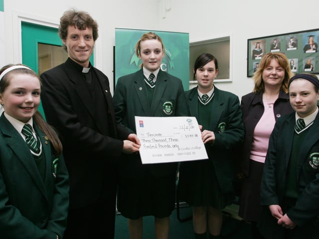 St. Cecilia's College students Ternair Hamilton, Kelly Prichard, Ashley Strawbridge and Colleen Healy presenting a cheque to Fr. Ronan Colhoun who received it on behalf of the Trocaire Fund. Included in photo is the college's charity co-ordinator Breige Lewis. (1404Jb45)