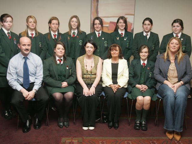 St. Cecilia's College students who received Citizenship Awards. Included are Brian McGuigan, co-ordinator, Reach Across, Hiliary McLaughlin, chairperson, Marie McAteer, Head of 6th Year, and Sharon Clifford, 6th form supervisor, St. Cecilia's College. (0205C35)