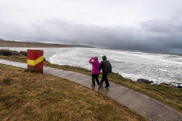 A bracing walk on the north coast as Storm Eunice blasts Northern Ireland. Photo: Kirth Ferris/ Pacemaker