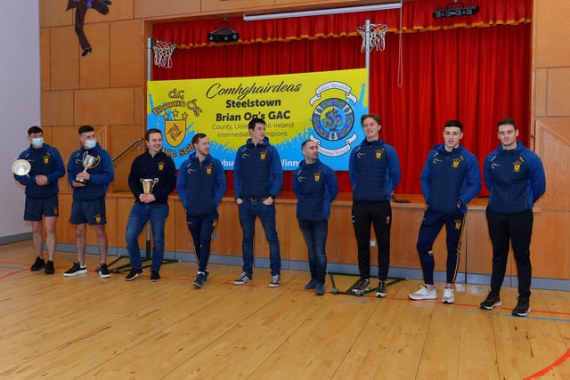Steelstown Brian Og’s players and coaches who visited St Patrick’s PS on Friday morning last. From left are Jason McAleer, Morgan Murray, Ciarán Flanaghan, Neil Forester, captain, Eoghan Heraghty, Garth Logue, Donncha Gilmore, Ben McCarron and Dermot McBride, coach. Photo: George Sweeney.  DER2208GS – 074