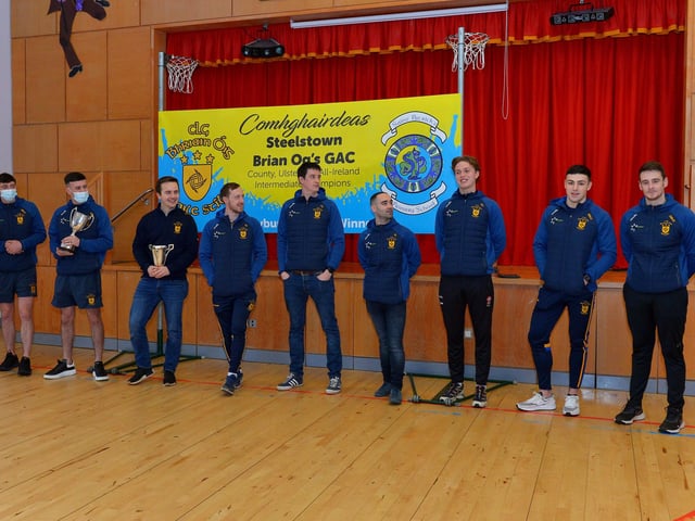 Steelstown Brian Og’s players and coaches who visited St Patrick’s PS on Friday morning last. From left are Jason McAleer, Morgan Murray, Ciarán Flanaghan, Neil Forester, captain, Eoghan Heraghty, Garth Logue, Donncha Gilmore, Ben McCarron and Dermot McBride, coach. Photo: George Sweeney. DER2208GS – 074